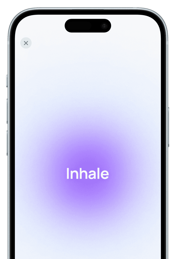 Smartphone displaying a breathing technique screen with the text 'Inhale', aimed at reducing emotional tension